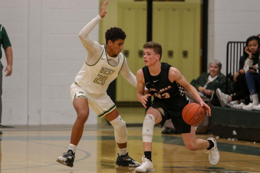 Marcus Morgan '21 defends Linn-Mar's John Steffen '20 on Dec. 20.