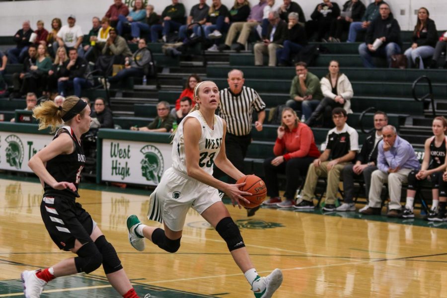 Audrey Koch '21 goes up for a layup against Western Dubuque.