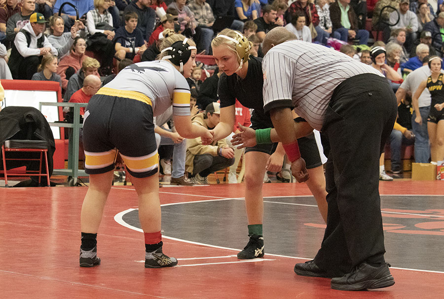 Katie Hoefer 21 stares down her opponent for the start of her first wrestling match at City on Dec. 16.