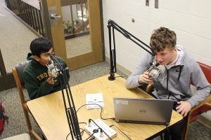 Mohan Kumar ´21 and Ken Wilbur 20 begin recording in the West High library.