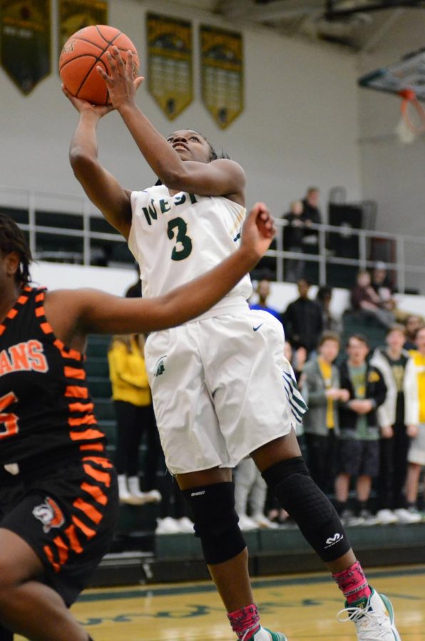 Mataiya Tellis '21 angles herself to take a layup in the game on Jan. 15.