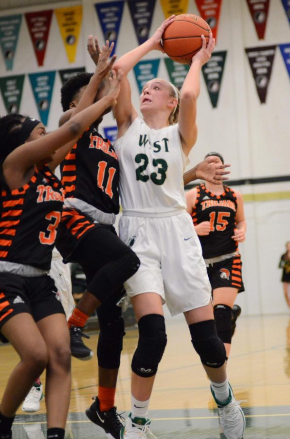 Audrey Koch '21 pushes through two blockers for to make a layup on Jan. 15. 