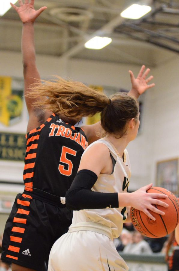 Grace Schnider '20 positions the ball behind herself getting ready to pass to a teammate on Jan. 15.