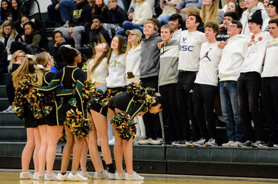 The West High Cheerleading team leads the student section in a chant on Jan. 21. 