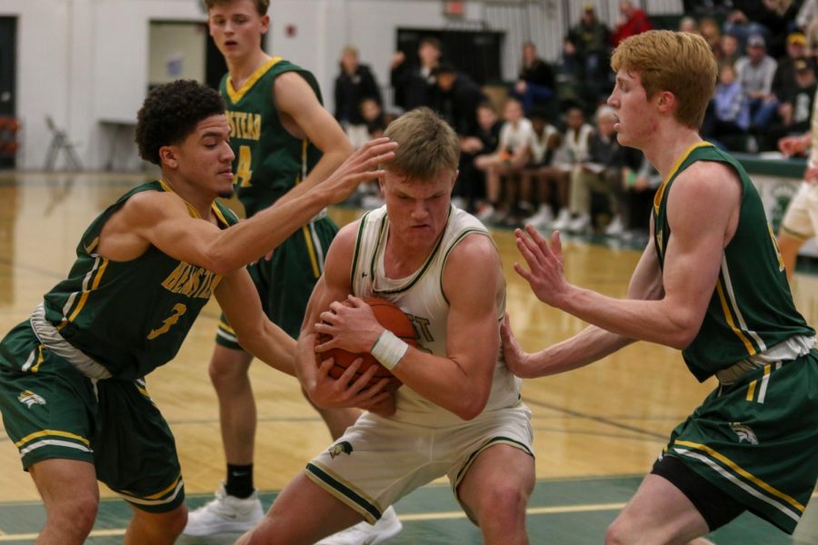 Tate Crane '20 hauls in a rebound against Dubuque Hempstead on Jan. 7.