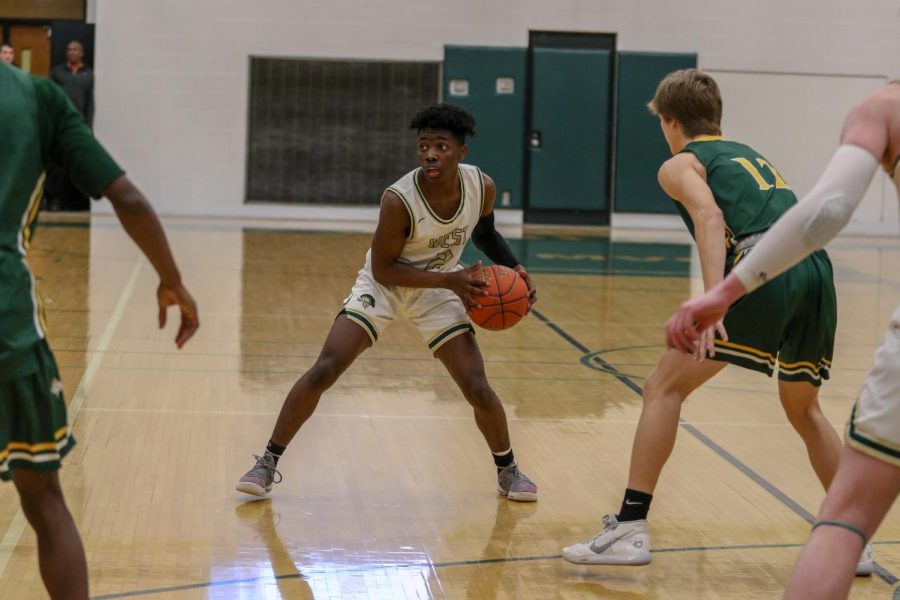 Christian Barnes '22 looks to pass against Dubuque Hempstead on Jan. 7.