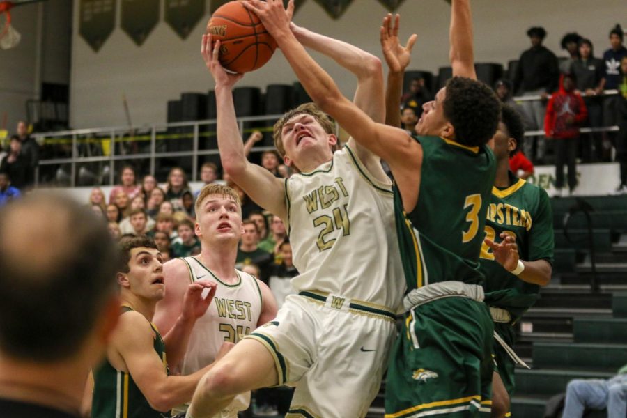 Ben Vander Leest '20 is fouled on his way up against Dubuque Hempstead on Jan. 7.