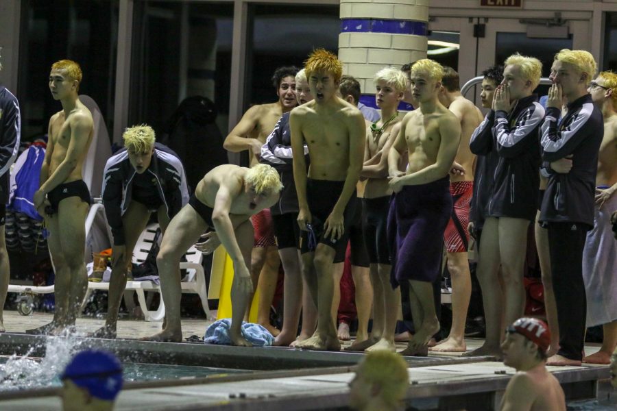 Jordan Christensen '22 and teammates cheer each other on against City on Jan. 21.