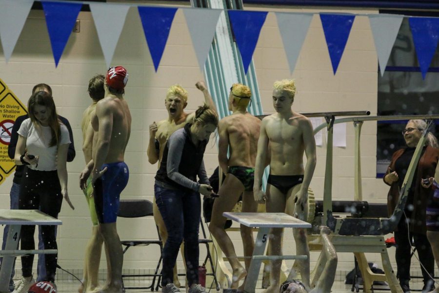 Luke Nichols '21 celebrates his team's 200-yard freestyle relay win against City on Jan. 21.