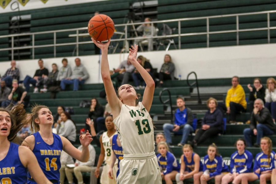 Grace Schneider '20 goes up for a layup against Dubuque Wahlert on Jan. 28.