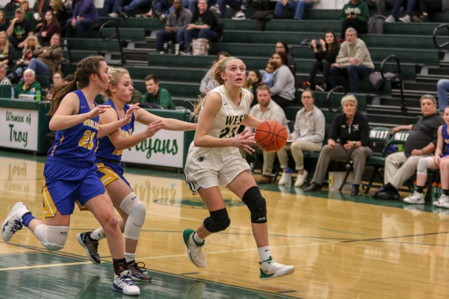 Audrey Koch '21 drives to the hoop on a fastbreak against Dubuque Wahlert on Jan. 28.