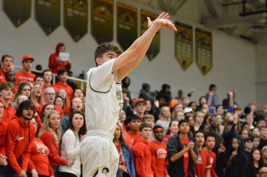 Joe Goodman '20 takes a three point shot. 