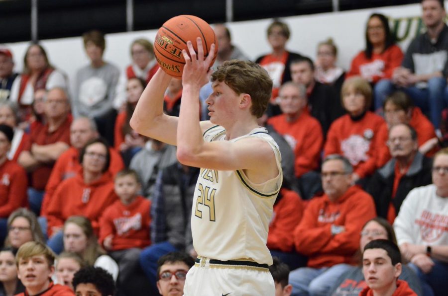 Ben Vander Leest '20 passes the ball back up the court to an open teammate. 