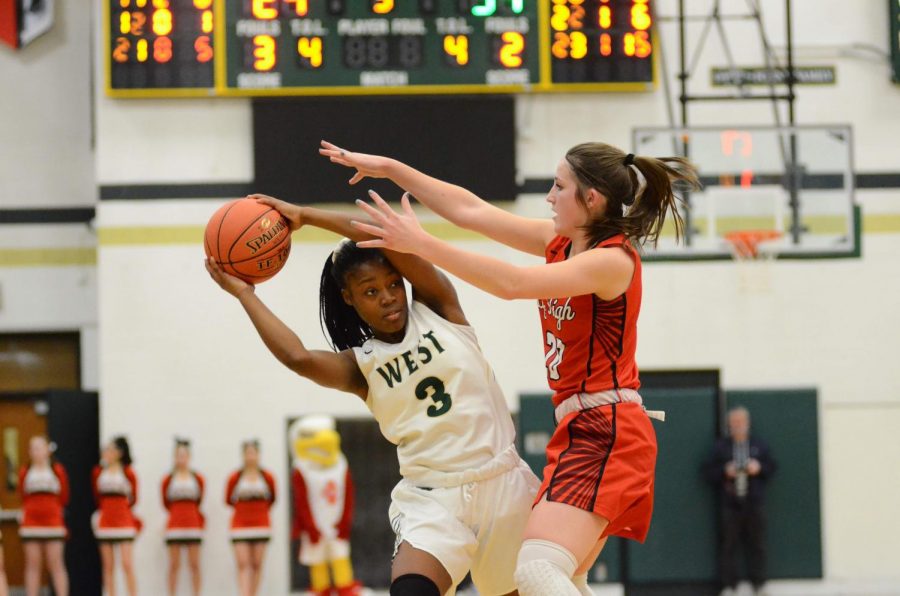 Matayia Tellis '21 plays strong offense against City on Jan. 31. 