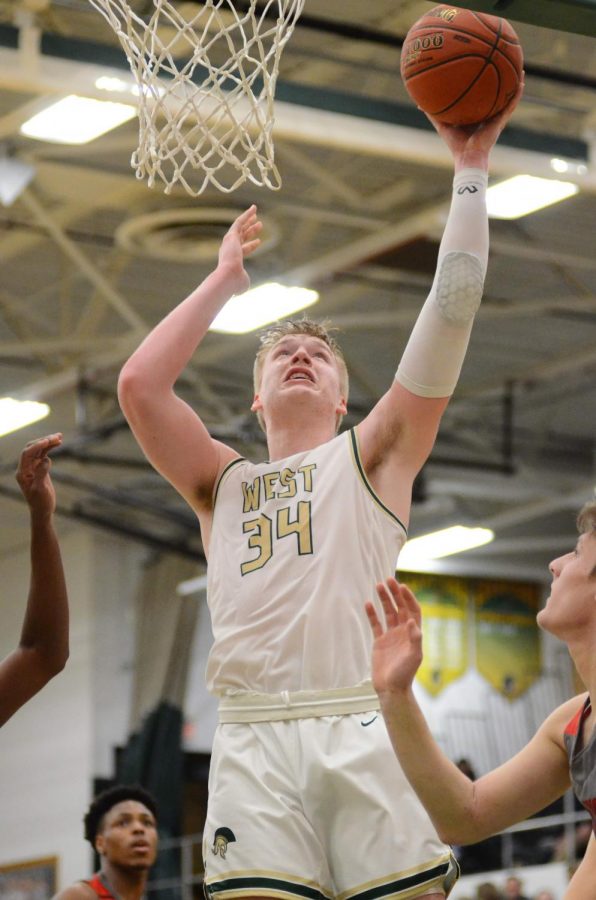 Even Brauns '20 goes up for a dunk in the second quarter on Jan. 31. 