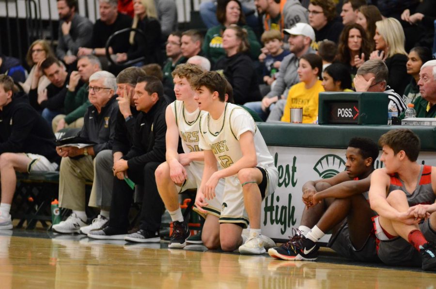 Joe Goodman '20 calls out plays for the Trojans on the sideline while waiting to be put into the game.