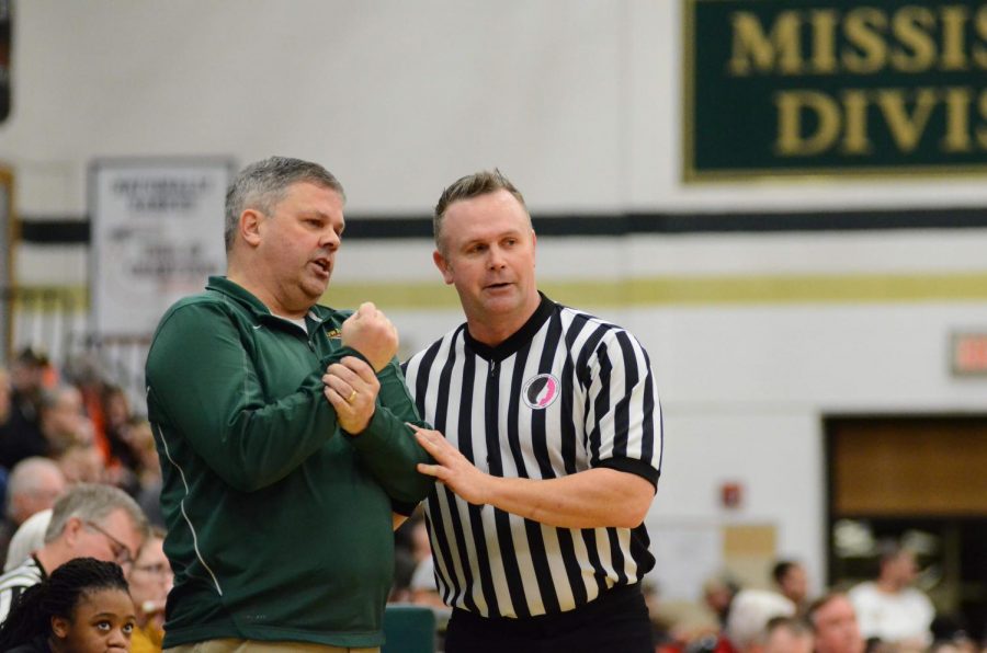 Coach Mayer respectfully argues his side of the foul call to the official. 