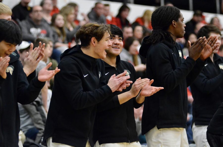 Nick Zamora ‘20 and Zach Anderson ‘21 cheer from the bench. 