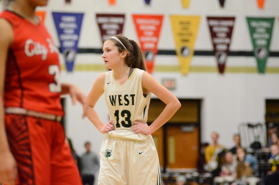 Grace Schneider '20 looks to Coach Mayer as the refs have a one-to-one conversation about a play.  