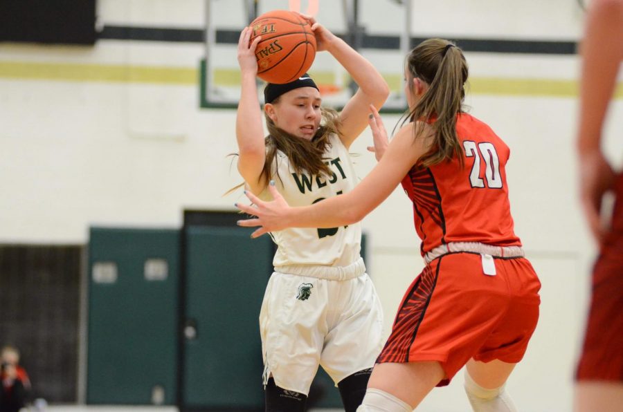 Jenna Saunders '21 struggles to keep the ball in her possession on Jan. 31