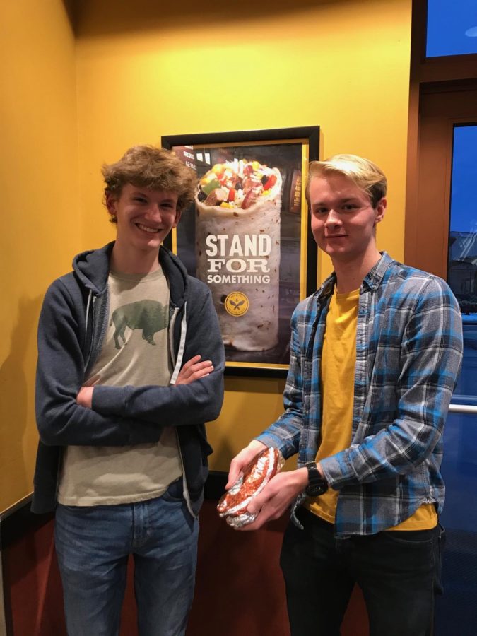 Julian Wemmie 20 and Riley Bridges 20 pose with a burrito in Pancheros.