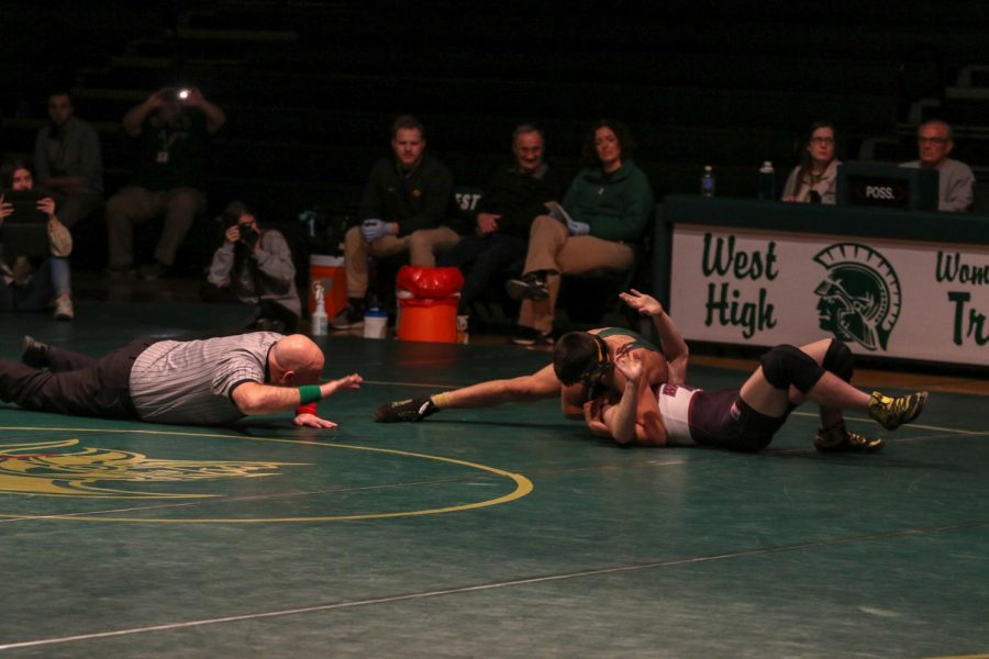 Hunter Garvin '22 pins his opponent in the second period during the team's Senior Night on Feb. 6.