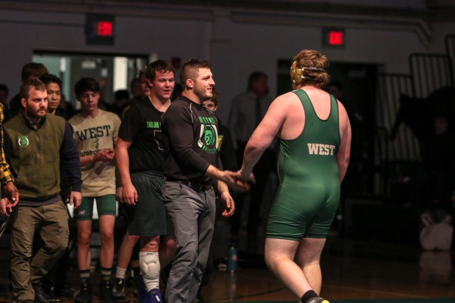 Ben Alden '21 walks off the mat after pinning his opponent in the second period.