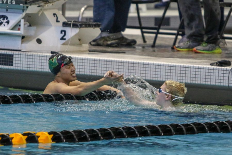 Nikolas Sung '22 congratulates his opponent after the 500 yard freestyle on Feb. 15.