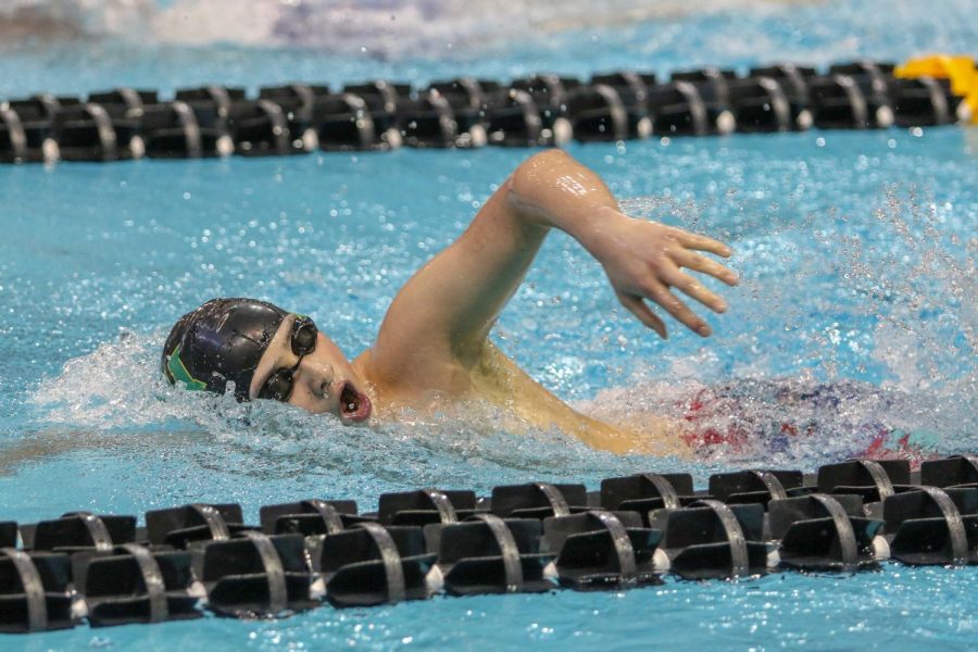 Andy Luo '22 takes a breath while swimming in the 500 yard freestyle on Feb. 15. Luo finished with a time of 4:51.54. 