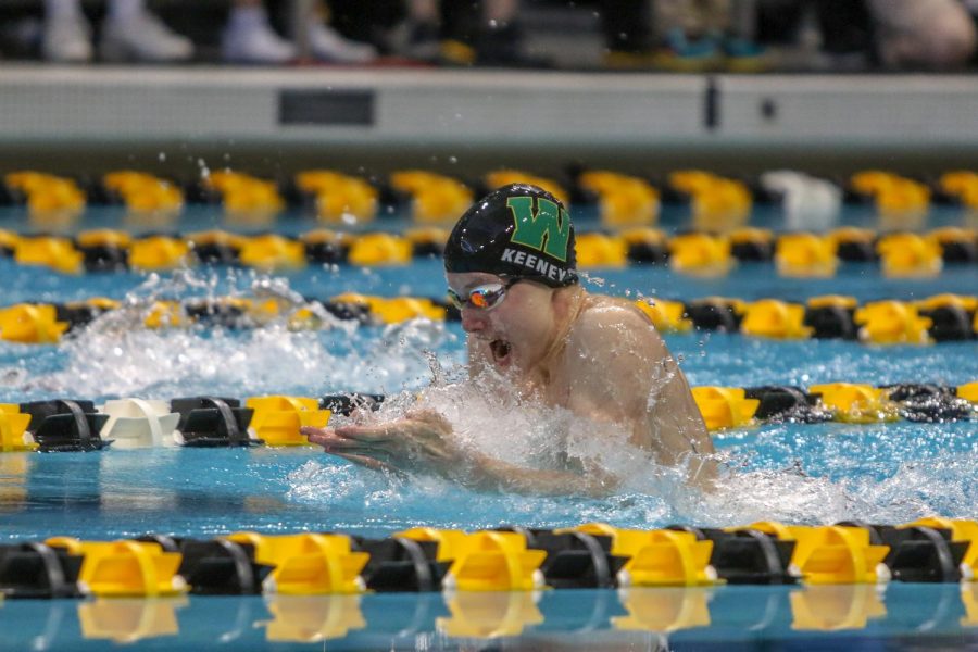 Gavin Keeney '22 swims in the 100 yard breaststroke on Feb. 15. Keeney finished with a time of 1:01.31.