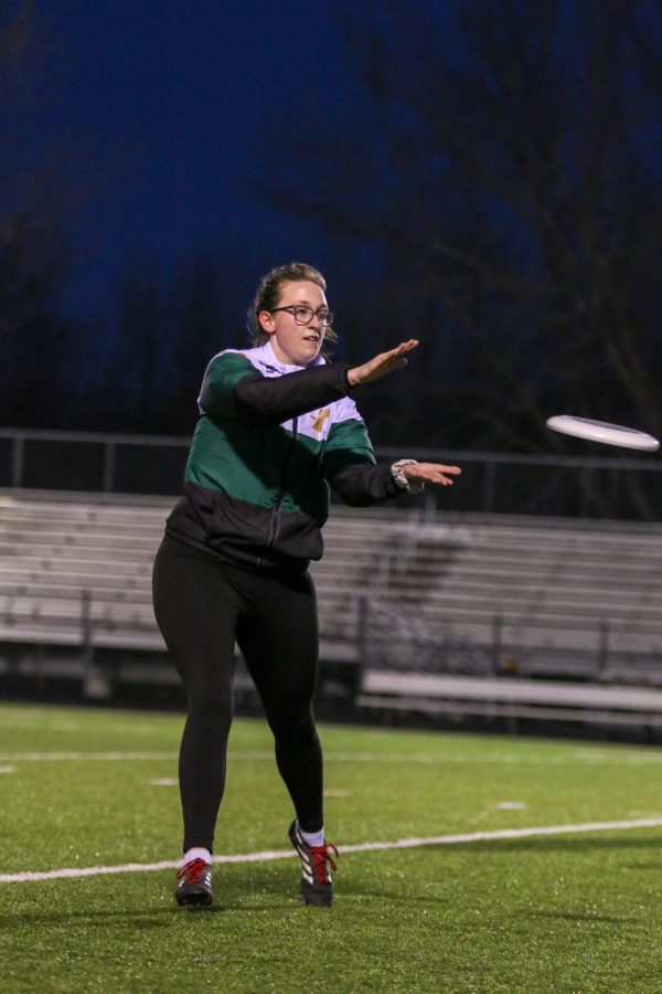 Emily Hill '20 secures the frisbee during the team's scrimmage.