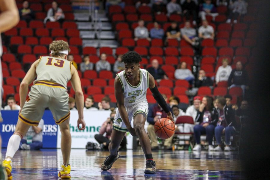 Christian Barnes '22 brings the ball up the floor during the state quarterfinal on March 11.