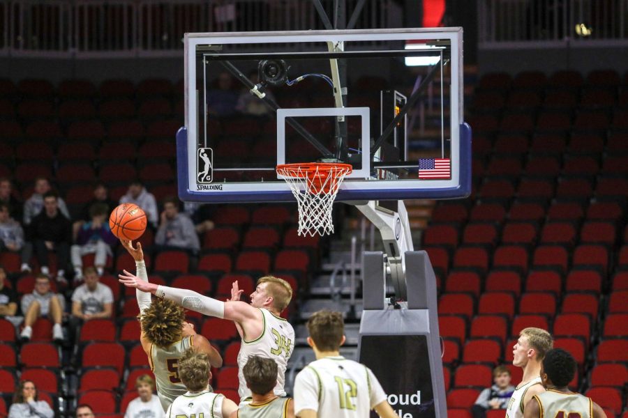 Even Brauns '20 reaches for a block during the state quarterfinal on March 11.