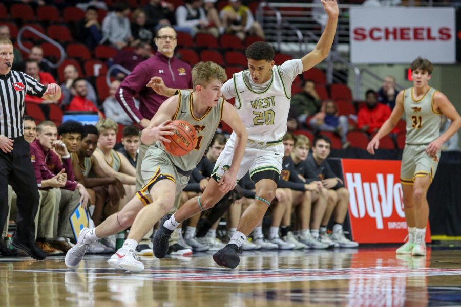 Marcus Morgan '21 pressures the Ankeny point guard during the state quarterfinal on March 11.