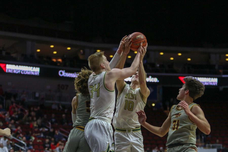 Even Brauns '20 and Tate Crane '20 fight for a rebound during the state quarterfinal on March 11.