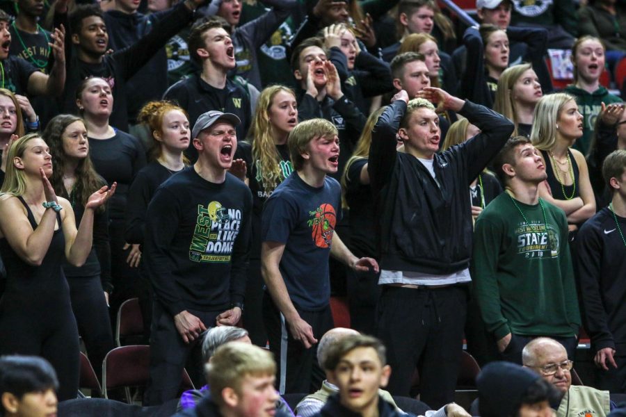 The student section questions a call during the state quarterfinal on March 11.