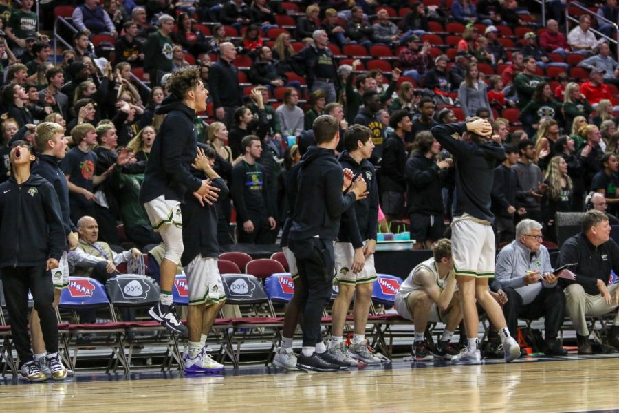 The bench questions a call during the state quarterfinal on March 11.