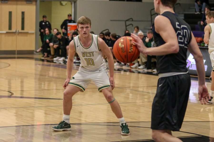 Tate Crane '20 plays defense in the Trojans' full court press against Pleasant Valley on March 3.