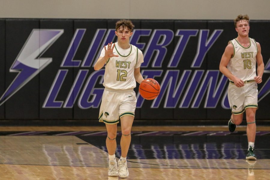 Joe Goodman '20 runs the offense as he walks the ball up the floor against Pleasant Valley on March 3.