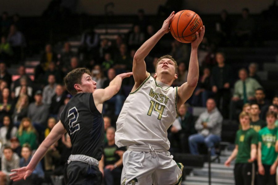 Nick Pepin '20 goes up for a layup against Pleasant Valley on March 3.