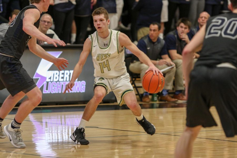  Nick Pepin '20 dribbles out the clock in the final seconds against Pleasant Valley on March 3.