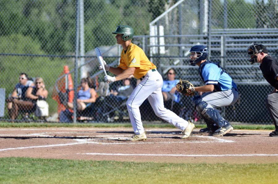 Ian McAreavy '21 shows a bunt June 25, trying to advance a teammate on second.