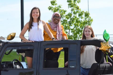 Seniors Kaitlyn Hansen, Khlood Saeed and Elena Koogler pose for a photo during the senior car parade on May 31.