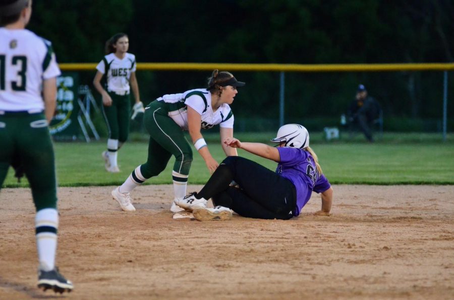 Freshman Lexi Nash tries for a double play after an out at first base by Liv Williams '21.