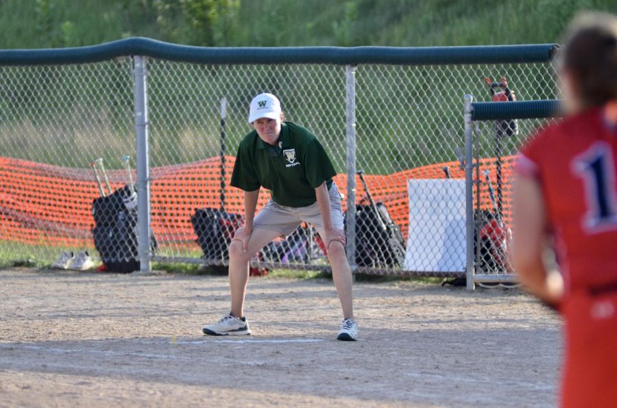 First base coach looks out at the field finding the next best play. 