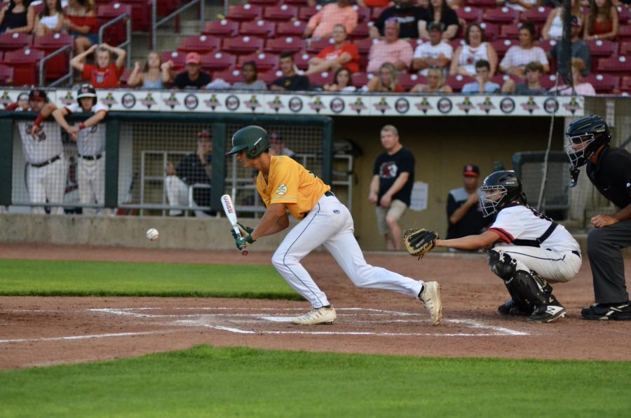 Nathan Guedenkauf '22 lays down a sacrifice bunt at Veterans Memorial Stadium on July 17. 