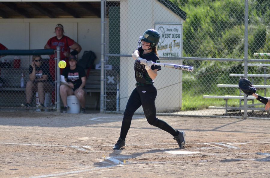 Eva Burbidge '20 takes a swing at a strike July 3.