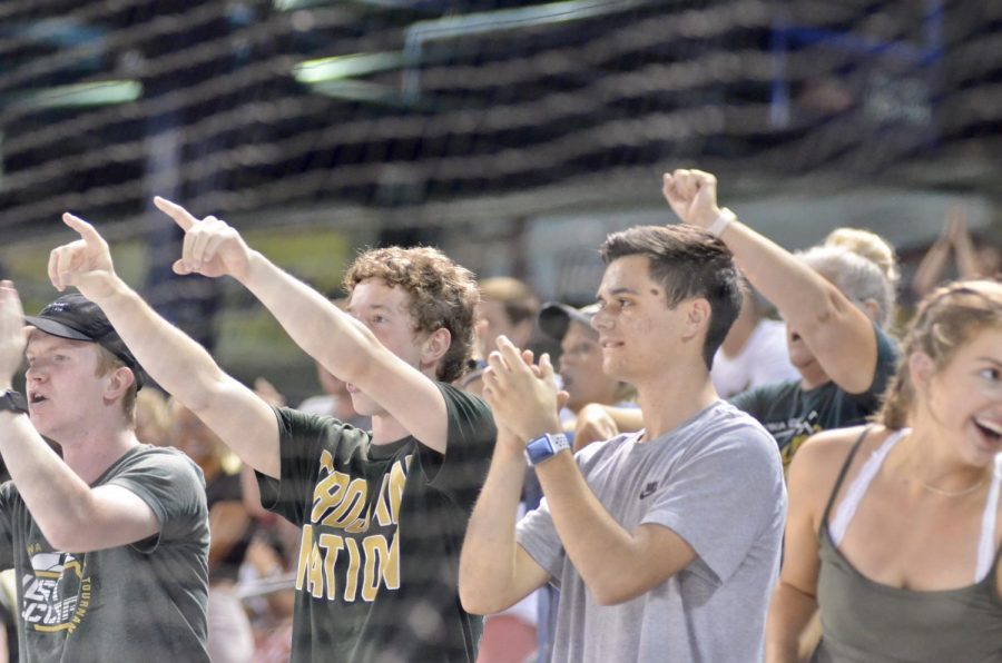 Students cheer on the baseball team at Veterans Memorial Stadium on July 17. 