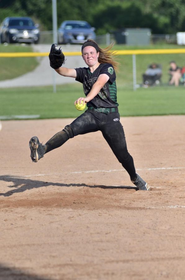 Eva Burbidge '20 leaps off the mound throwing a strike July 3.