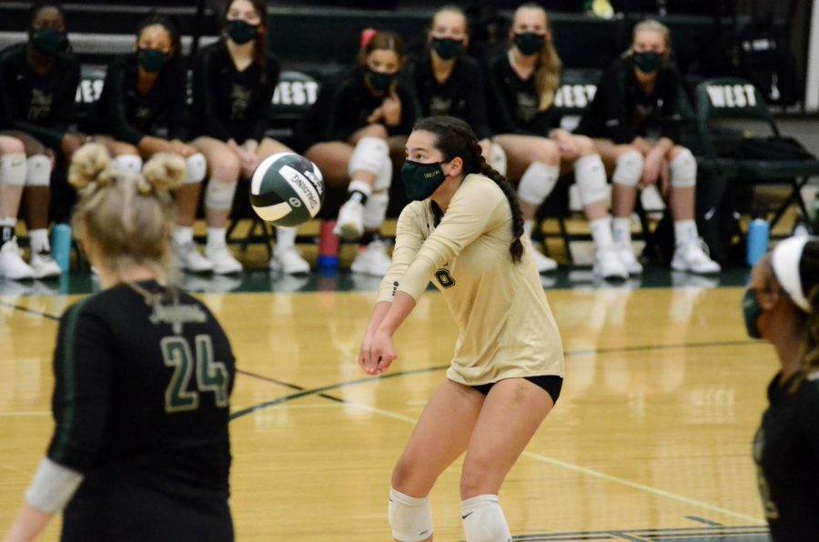 Alaina Greenlee '23 bumps the ball to the setter against Kennedy on Aug. 25.